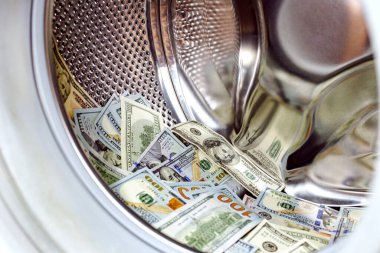 Para aklama. Çamaşır makinesi ve dolar. Para ve çamaşır makinesi deposu. Kural: Vergi kaçırma