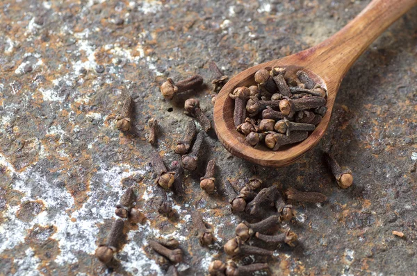 Cloves Wooden Spoon Textured Background — Stock Photo, Image