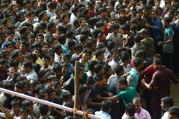 Crowd of young People enjoying "Govinda" the Dahi Handi festival to celebrate God Krishna's Birth Stock Image