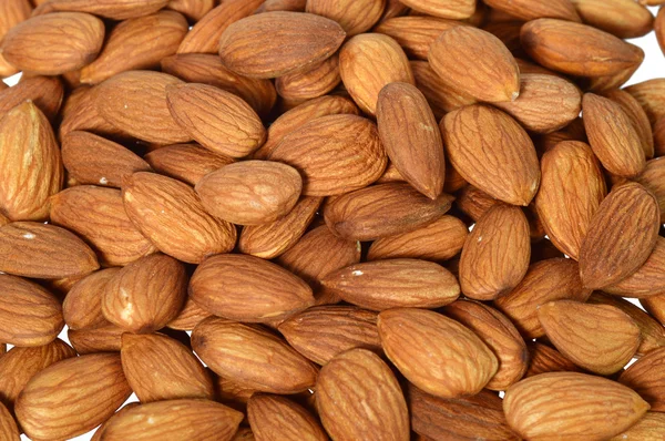 Pile of almonds as background — Stock Photo, Image