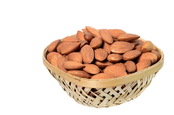 Almonds in a wooden (Bamboo) basket — Stock Photo, Image