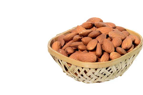Almonds in a wooden (Bamboo) basket — Stock Photo, Image