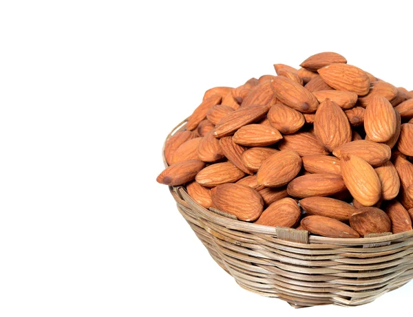 Almonds in basket isolated on white — Stock Photo, Image