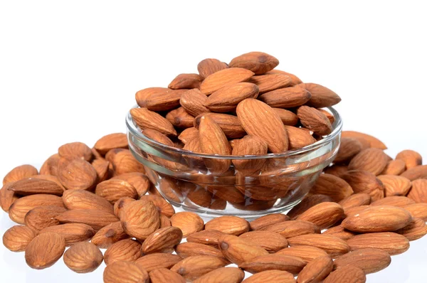 Almonds in a glass bowl with heap — Stock Photo, Image