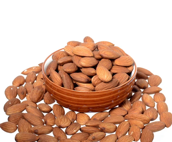 Almonds in a bowl with heap — Stock Photo, Image