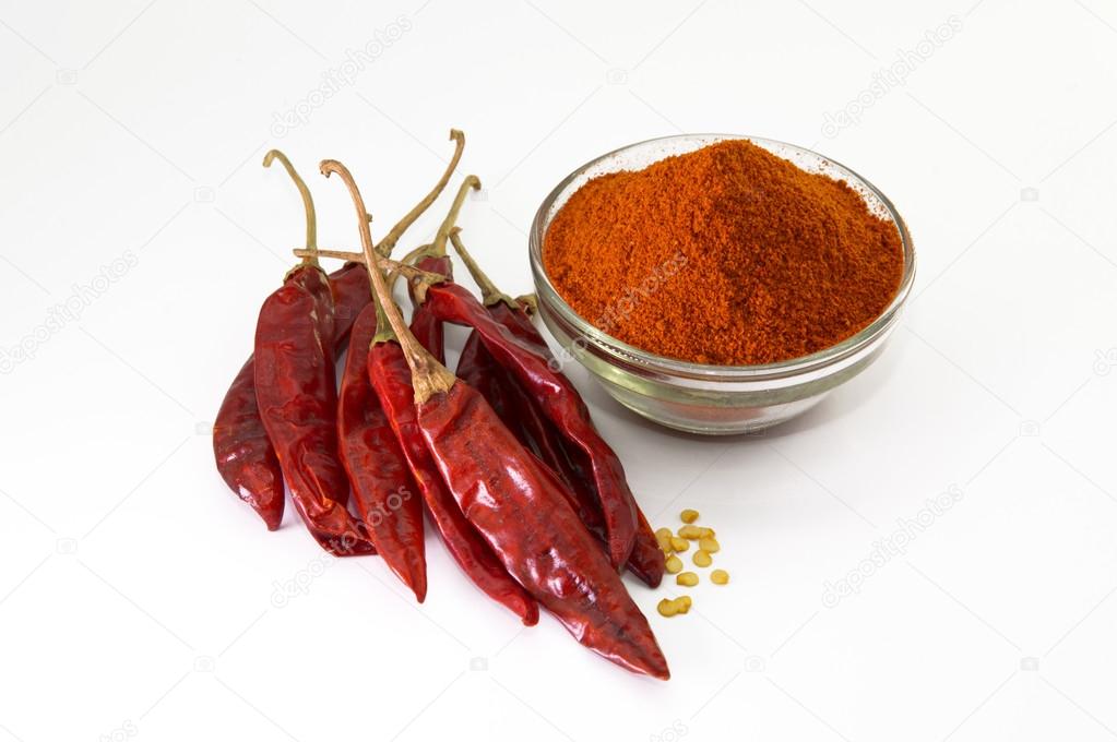 Chilly powder in bowl with red chilly, dried chillies