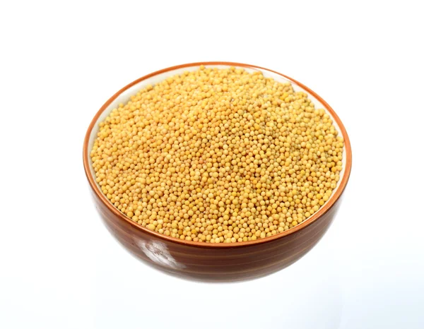 Yellow mustard seeds in bowl — Stock Photo, Image