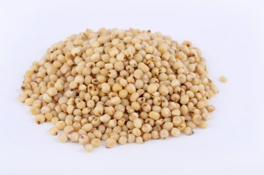 Heap of Jowar (Sorghum) on white background, Close up. clipart