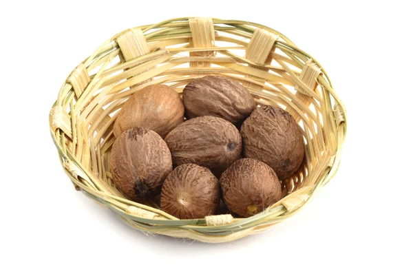 Nutmeg in bamboo basket — Stock Photo, Image