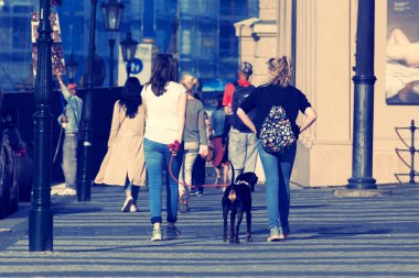 Two unknown girls walking the street