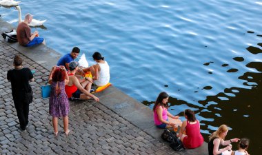 An Unidentified People on Prague Embankment