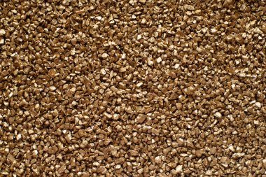 Küçük altın parçacıkları dekorasyon taşları arka plan