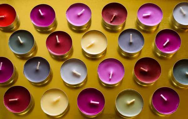 Colored Tea Candles on Gold Plate — Stock Photo, Image