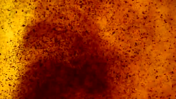 Flowing Particles in Orange Liquid — Stock Video