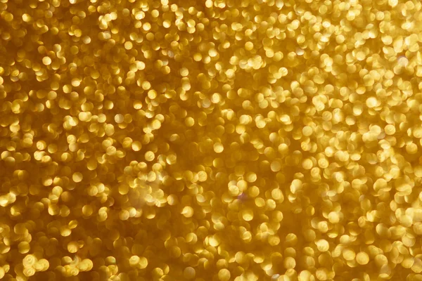 Luces de Navidad brillantes de oro. Fondo abstracto borroso — Foto de Stock