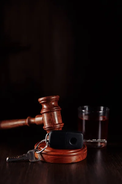 Car key, judge gavel and bottle of alcohol with glass. Drunk driving concept. Vertical image — Stock Photo, Image