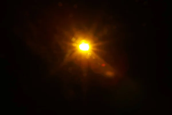 Abstract Natural Sun flare on the black — Stock Photo, Image