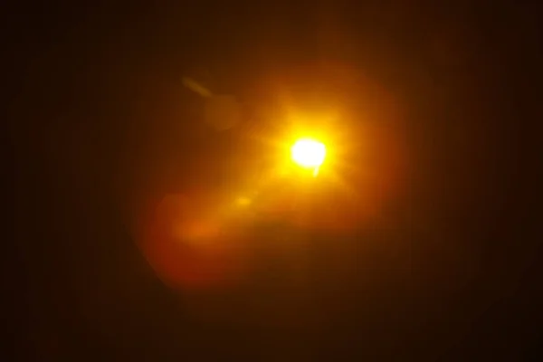 Siyah arkaplanda soyut Doğal Güneş patlaması. — Stok fotoğraf