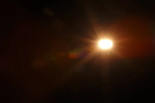 Αφηρημένη φυσική ηλιακή έκλαμψη στο μαύρο — Φωτογραφία Αρχείου