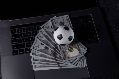 Bets, sports betting, bookmaker concept. Soccer ball on a keyboard