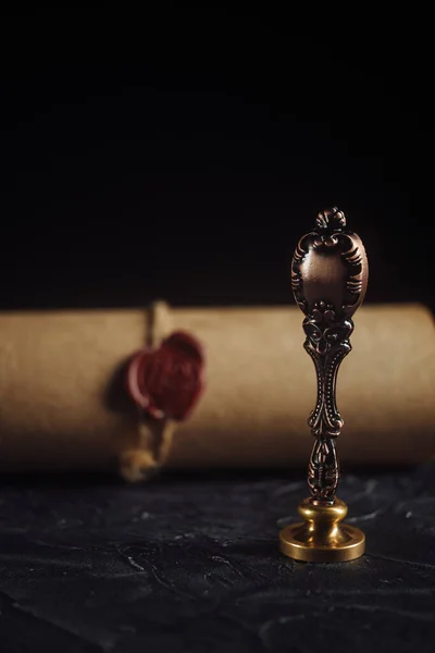 Last will and notary seal on a dark table close-up