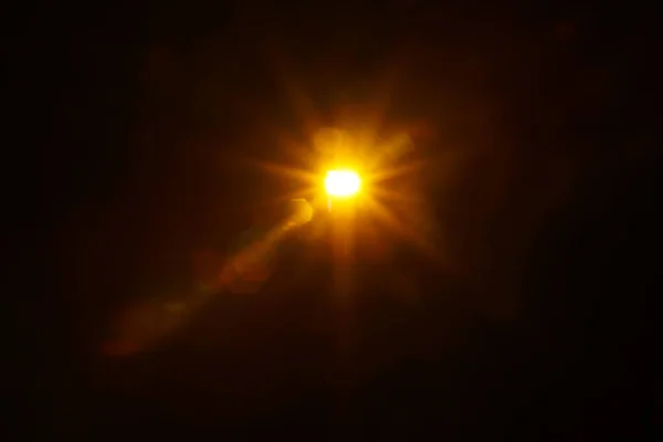 Abstract Natural Sun flare on the black — Stock Photo, Image