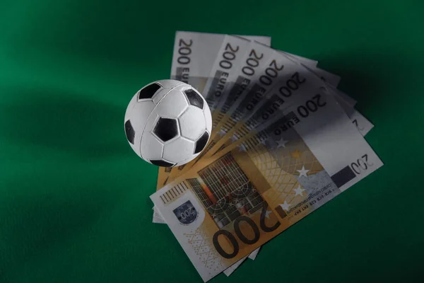 Soccer ball and money. Sport, gambling, money win concept — Stock Photo, Image