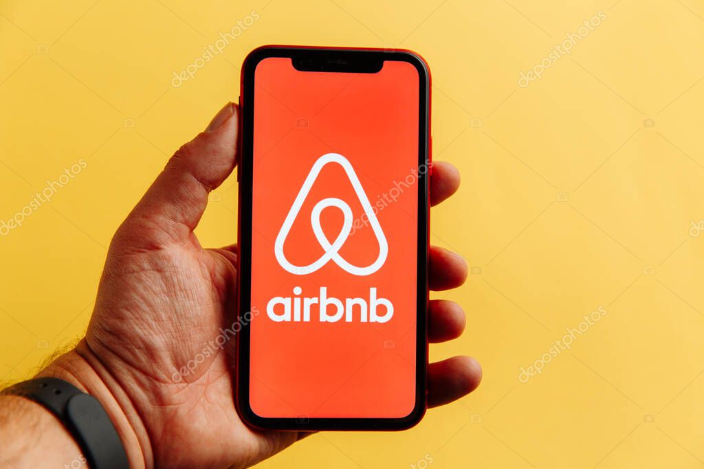 Tula, Russia - October 18, 2020: Airbnb logo on iPhone display.