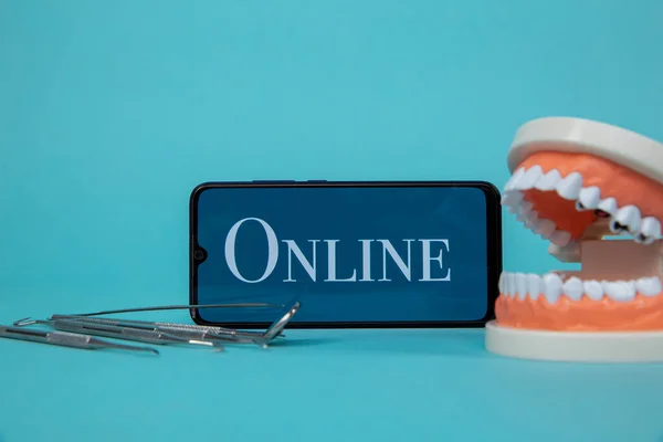 Phone online appointment to the dentist concept.