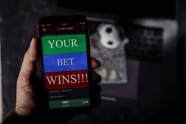 Lucky winner at football betting with phone in hand. Betting and sport concept — Stock Photo, Image