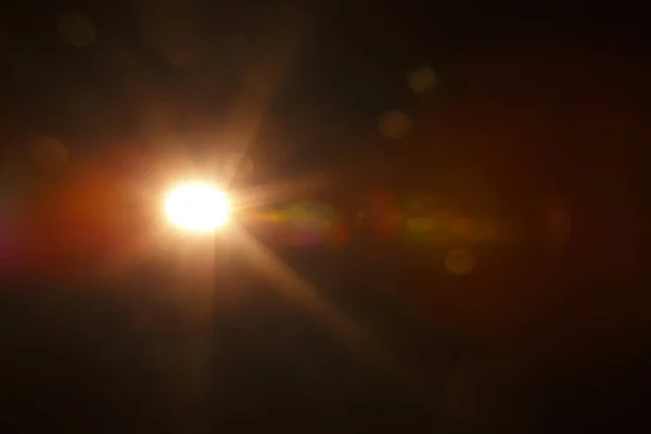 Αφηρημένη φυσική ηλιακή έκλαμψη στο μαύρο — Φωτογραφία Αρχείου