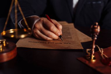 Man signing a Last Will and Testament document clipart
