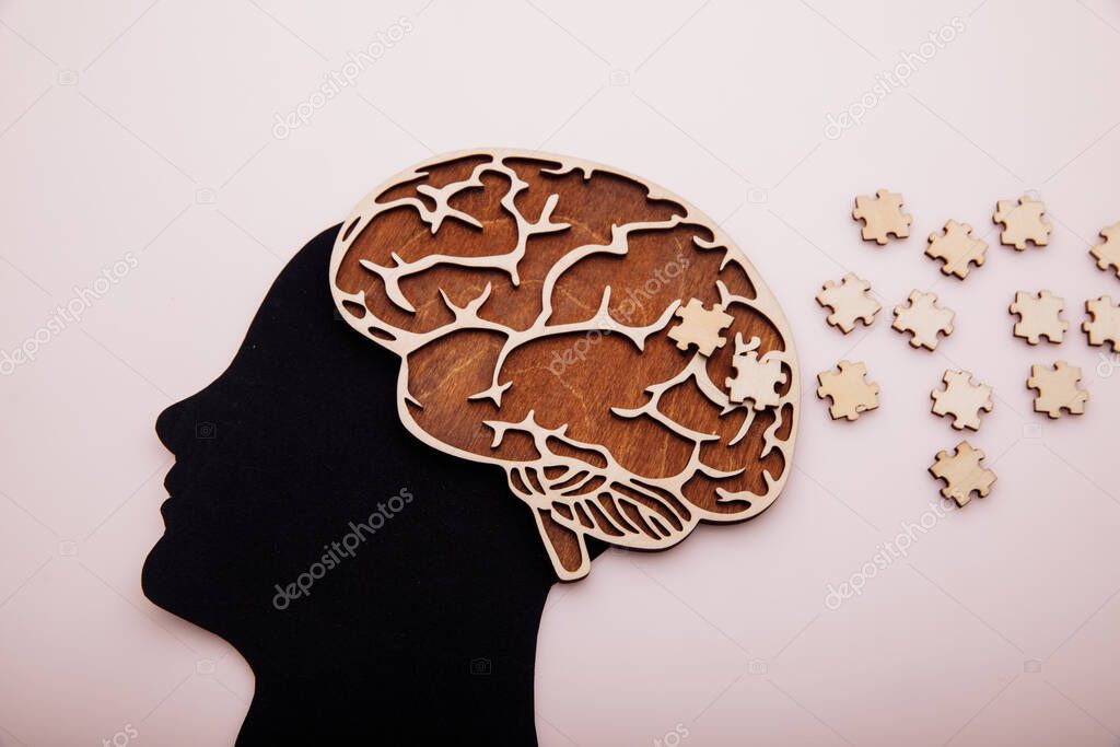 Head of man with brain and puzzle. Alzheimers disease, dementia and mental health concept
