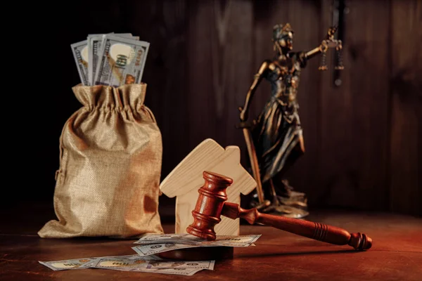 Real estate auction concept, money bag with cash, house and judge gavel with lady of justice — Stock Photo, Image