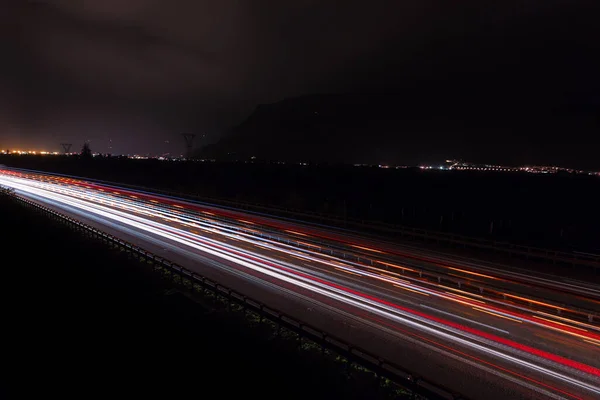Light trails in Bolzano on the Autostrada 22 in italy. Red White and yellow Light trails on the Highway in South Tyrol
