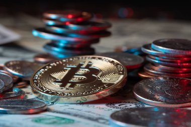Bitcoin in front of piled up US dollar coins. Crypto currency Technology
