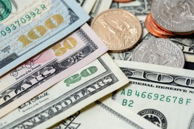 US Dollar Banknotes with shiny denomination  numbers, Banknotes next to Dollar coins, 1 Dollar and Half Dollar coin