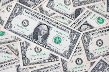 Arka plan olarak bir dolar banknot. Yukarıdan aşağıya doğru 1 banknot dağıt. Amerikan Doları.