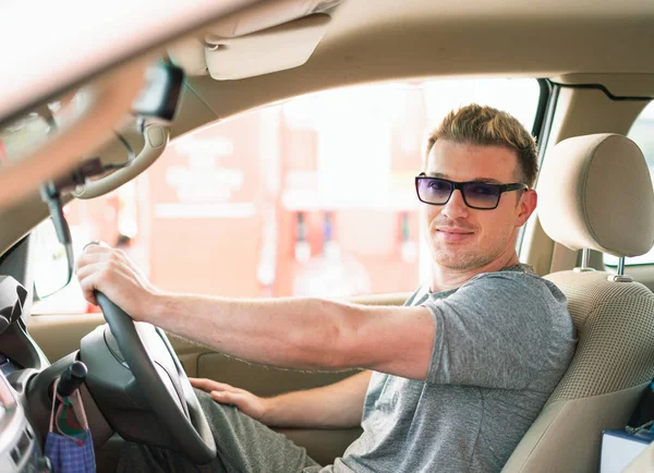 White caucasian car owner ready to drive auto car from fuel car parking with happiness after filling high energy power fuel into auto car tank in petrol station, commercial service for benzine, diesel, gasohol, gasoline.