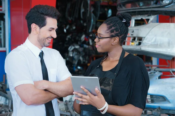 Woman work with man, very happy. Diversity of two people, black African worker woman very happy to work with caucasian business manager in factory-warehouse