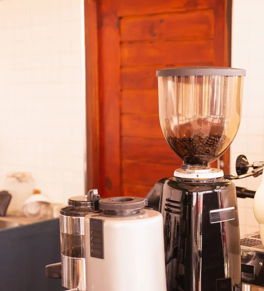 Grinders and coffee maker at coffee bar. Barista work at food and