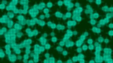 Parlayan yeşil parçacıklar ve bokeh etkisi içeren dinamik soyut arkaplan bilim, teknoloji veya tıbbi görseller için idealdir..