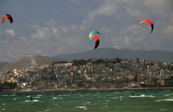 Kite surfing on a very windy day at the coast of Athens, Greece