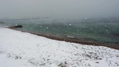 Aspect of an intense snowstorm at a beach near Athens , Greece, in February 2021