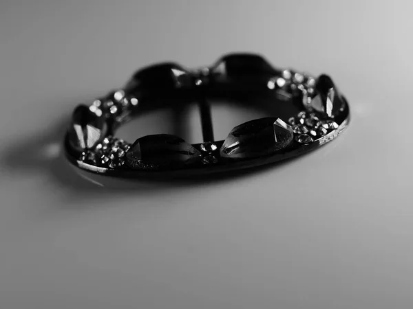 Brooch with pearls isolated on black, with diamonds, selective focus, DOF, macro, on white background