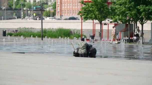 A janitor drives a cart with garbage bags — Stock Video