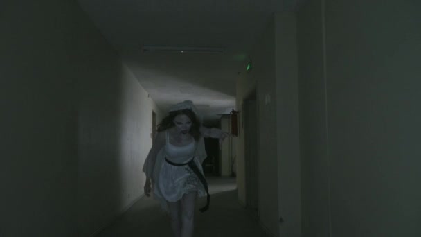 The ghost of the bride runs after her victim down — Stock Video