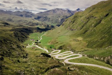 Drone photo of winding roads on Julierpass in Switzerland clipart