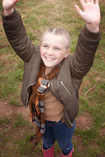 Pretty young girl with freckles reaching upwards — Stock Photo, Image