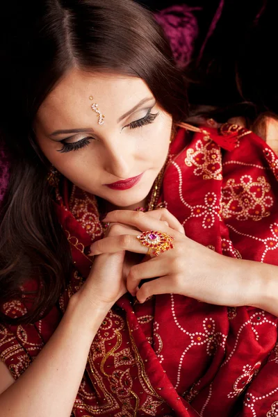 Beautiful Indian woman with eyes cast down — Stock Photo, Image